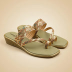 A pair of women's Slipper with a muted sage green footbed and straps featuring a multicolor geometric pattern, set against a solid beige background.